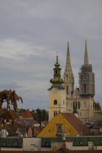 View of buildings in city against sky