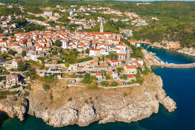 High angle view of townscape by sea