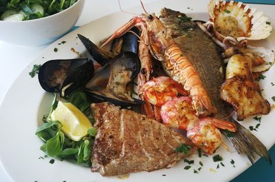 High angle view of fish served in plate on table