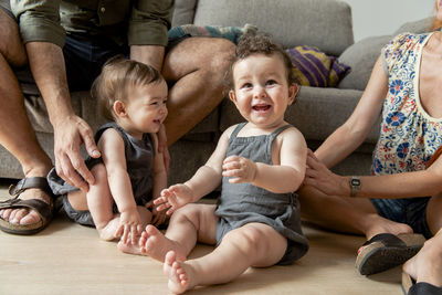 Baby boy and girl fraternal twins playing at home.