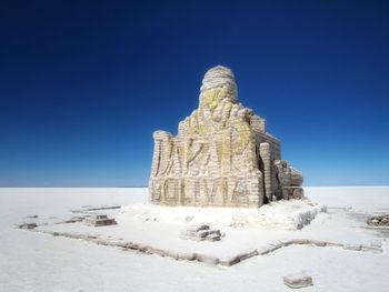 View of castle against clear blue sky