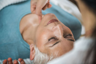 Close-up of woman getting massage at spa