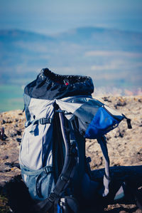 Backpack with sea in background