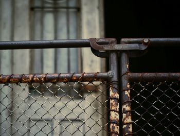Close-up of padlock on metal railing