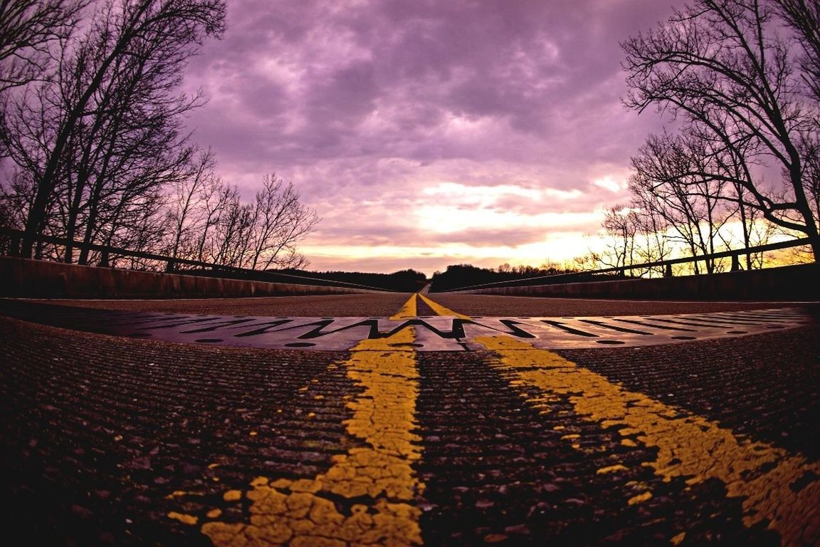 sunset, sky, bare tree, silhouette, cloud - sky, tree, orange color, cloud, cobblestone, sunlight, the way forward, street, cloudy, outdoors, road, nature, tranquility, full length, sun, footpath