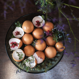 High angle view of egg shells in bowl on table