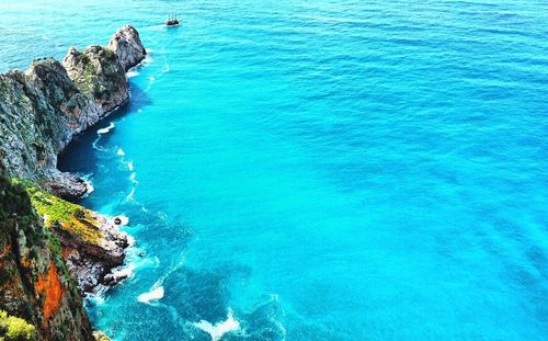 Scenic view of sea against blue sky