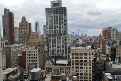 Modern buildings in city against sky