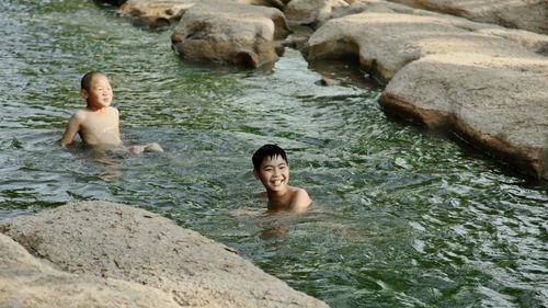 Portrait of a boy swimming in water