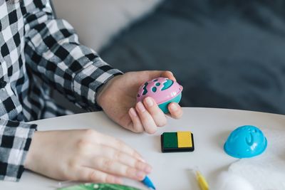 Midsection of girl holding easter egg