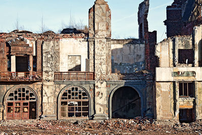 Abandoned building against sky in city