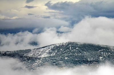 Scenic view of snow covered mountains