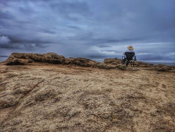 Man standing on land against sky