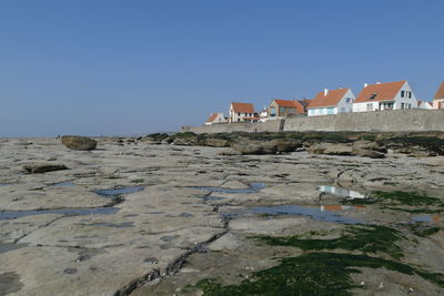 Panoramic view of buildings against clear sky