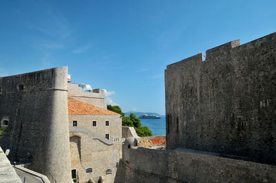 Looking at modern cruise ship through old forts walls in dubrovnik