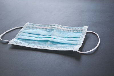 High angle view of empty blue table against white background