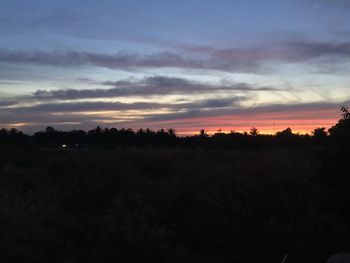 Scenic view of silhouette landscape against sky during sunset