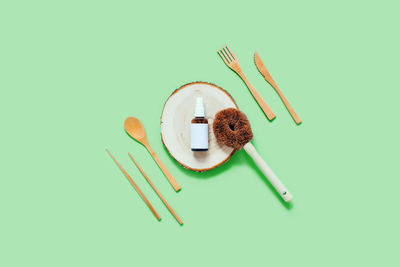 Eco-friendly kitchen accessories. bamboo spoons, forks, oil spray and sponge.