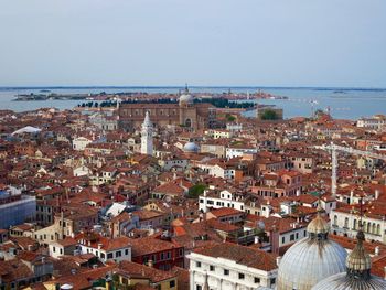 High angle shot of townscape against the sea