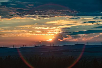 Scenic view of silhouette landscape against sky during sunset