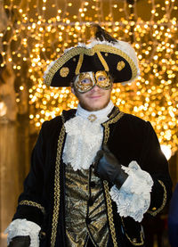 Portrait of man wearing costume and mask during venice carnival