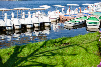Boats moored in lake
