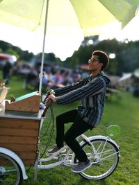 Full length of woman standing on bench