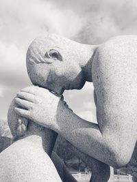 Low angle view of statue against sky