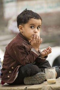 Portrait of cute boy looking away