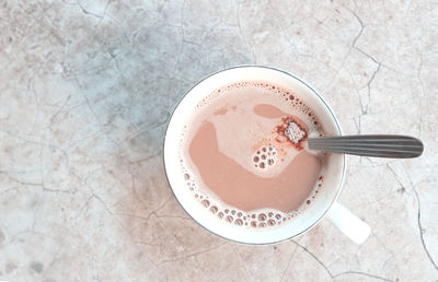 High angle view of coffee cup on table