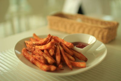 Close-up of french fries with tomato ketchup