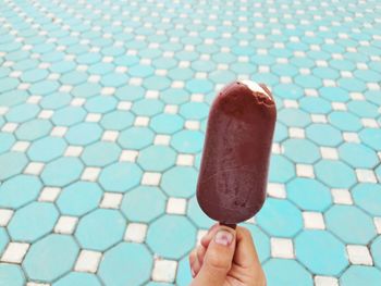 Close-up of hand holding ice cream