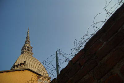 Low angle view of building against clear blue sky