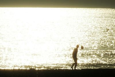 Woman standing on beach