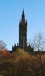 Low angle view of built structure against clear blue sky