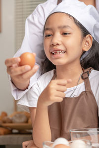 Portrait of smiling girl holding ice cream