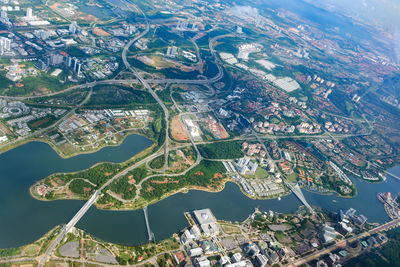 Aerial view of city by sea