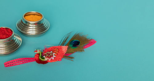 High angle view of butterfly on blue table