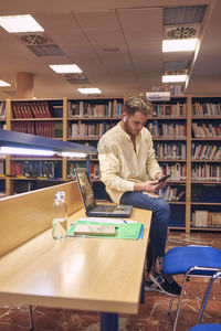 Man looking at book