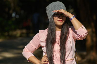 Close-up of young woman standing outdoors