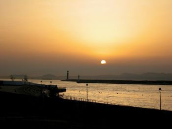 Scenic view of sea against clear sky during sunset