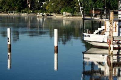 Boats moored in lake