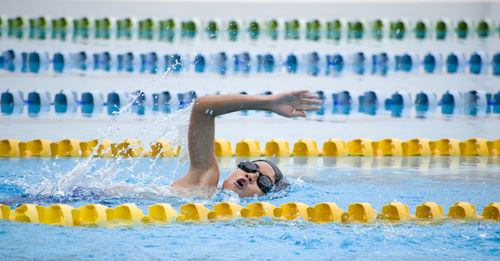 Boy swimming in pool