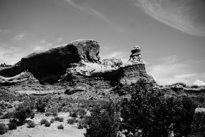 Low angle view of rock formation against sky