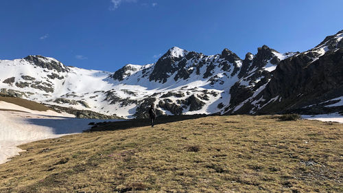 Scenic view of snowcapped mountains against clear sky