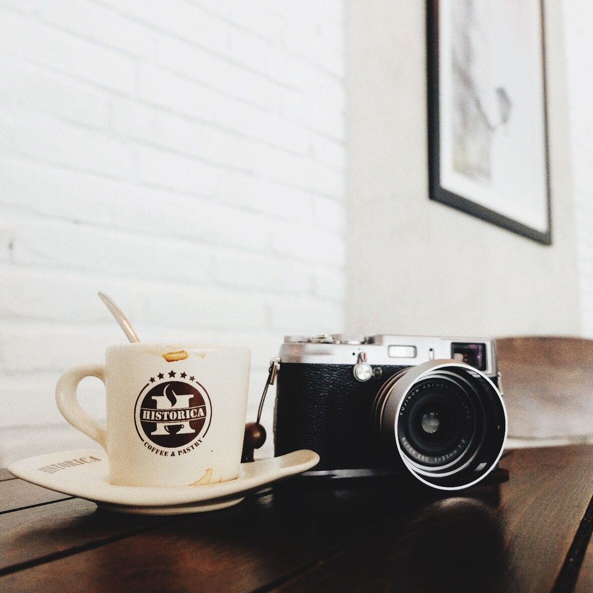 indoors, table, still life, technology, coffee cup, retro styled, old-fashioned, communication, close-up, no people, coffee - drink, antique, high angle view, home interior, wood - material, photography themes, equipment, wall - building feature, telephone, coffee