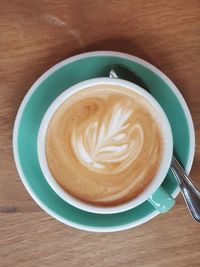 High angle view of cappuccino on table