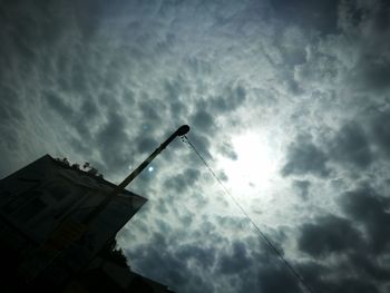 Low angle view of building against cloudy sky