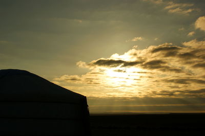 Scenic view of silhouette land against sky during sunset