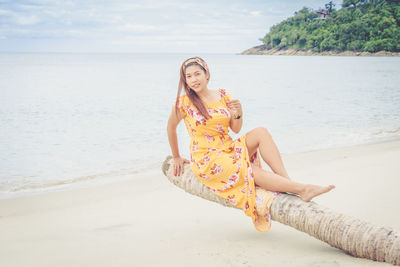 Portrait of beautiful young woman on beach